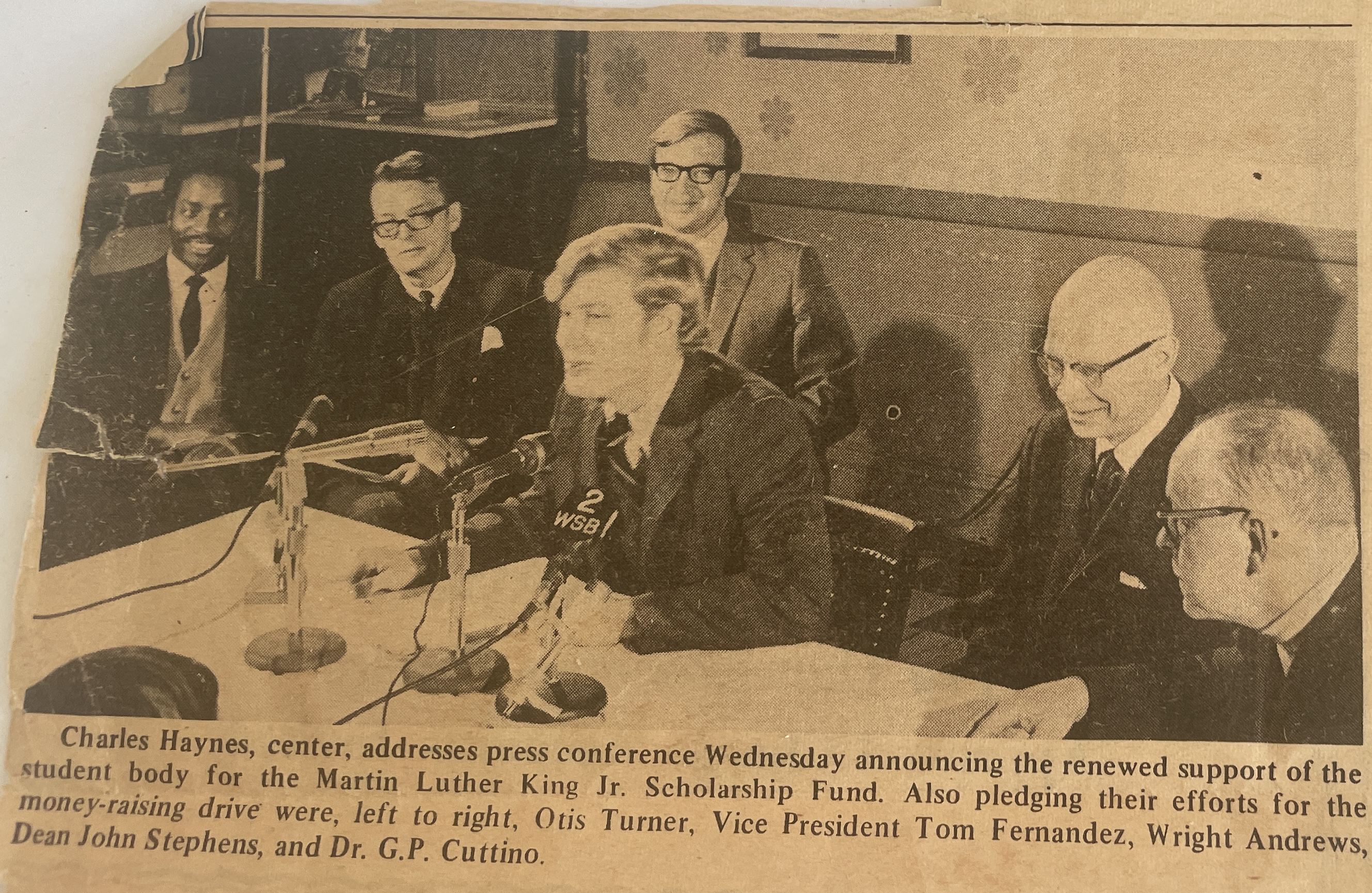 Newspaper clipping depicting Emory support of MLK Scholarship at press conference