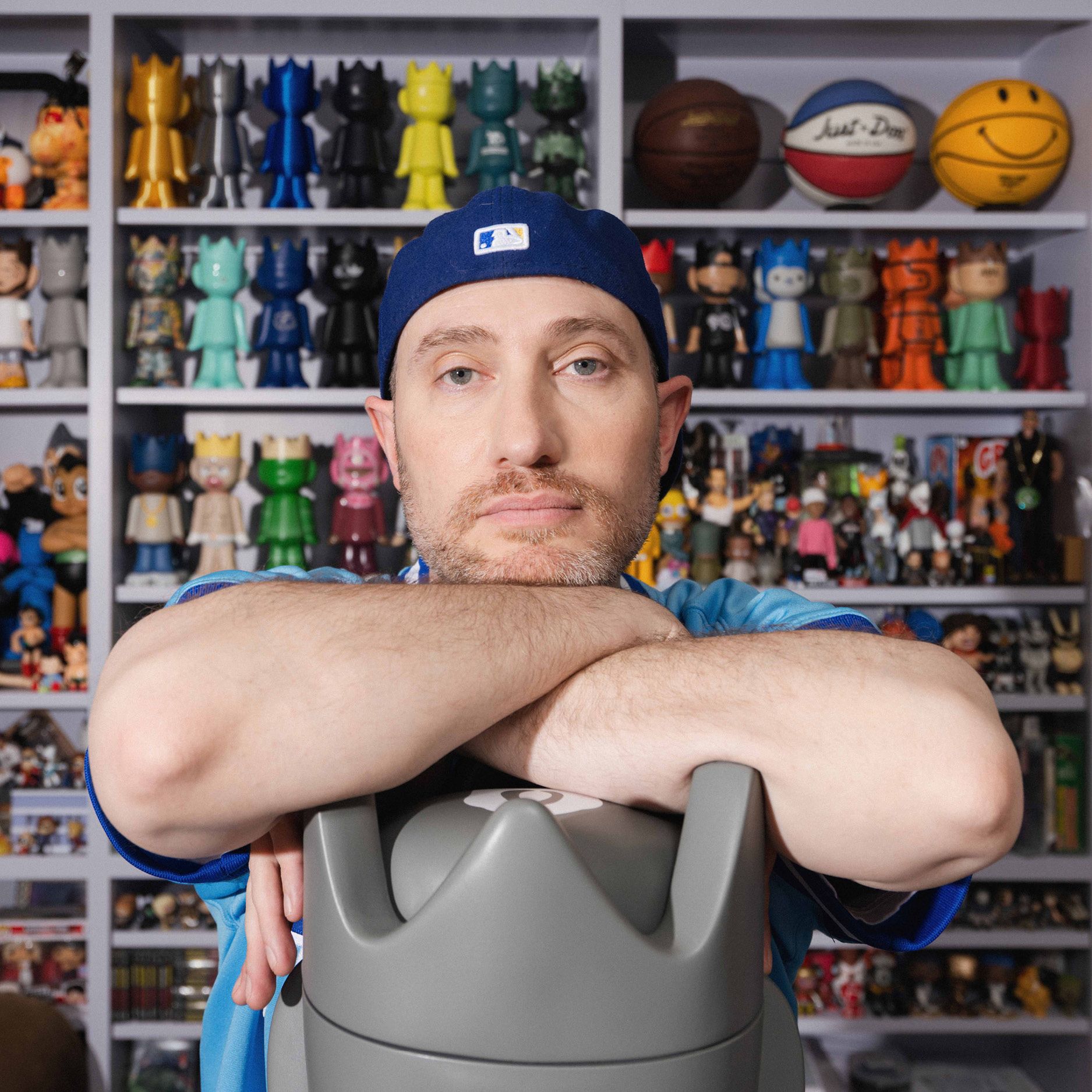 Portrait of Josh Luber in front of his collectibles.