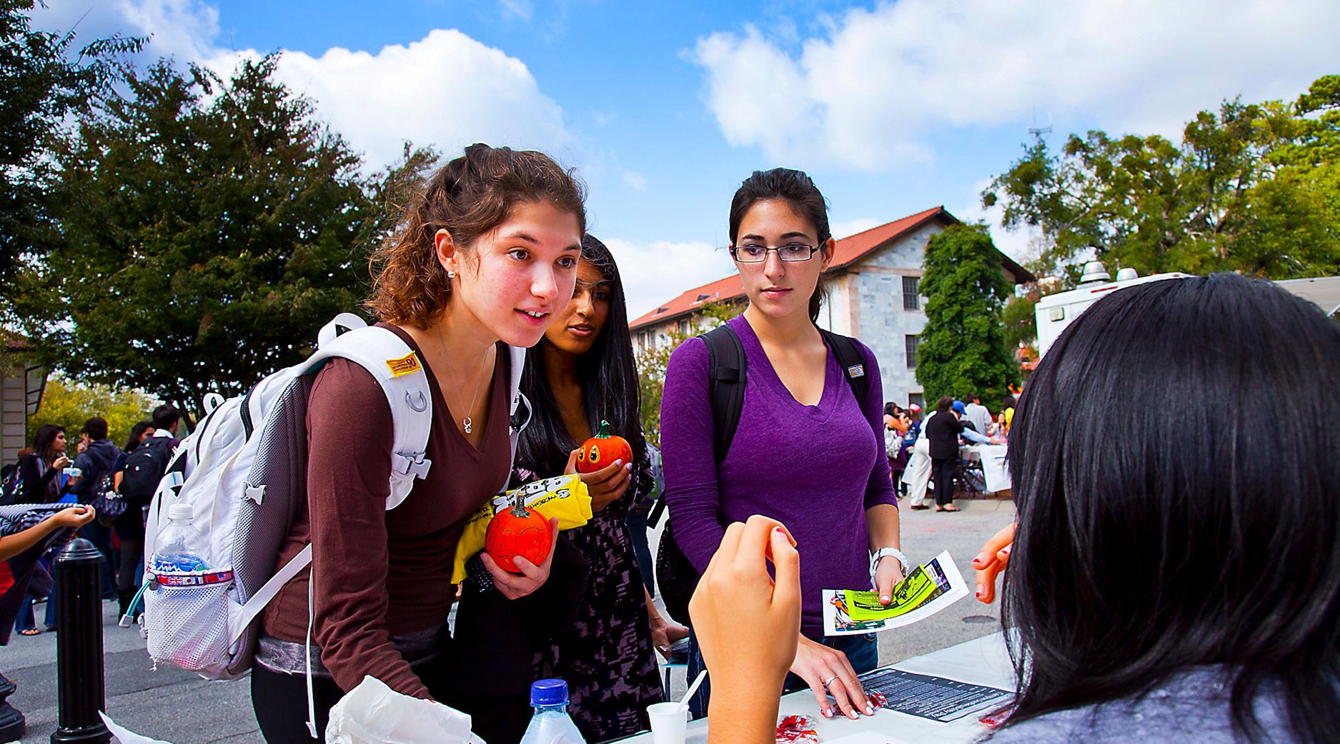 Photos students talking at a table set up during a Wonderful Wednesday.