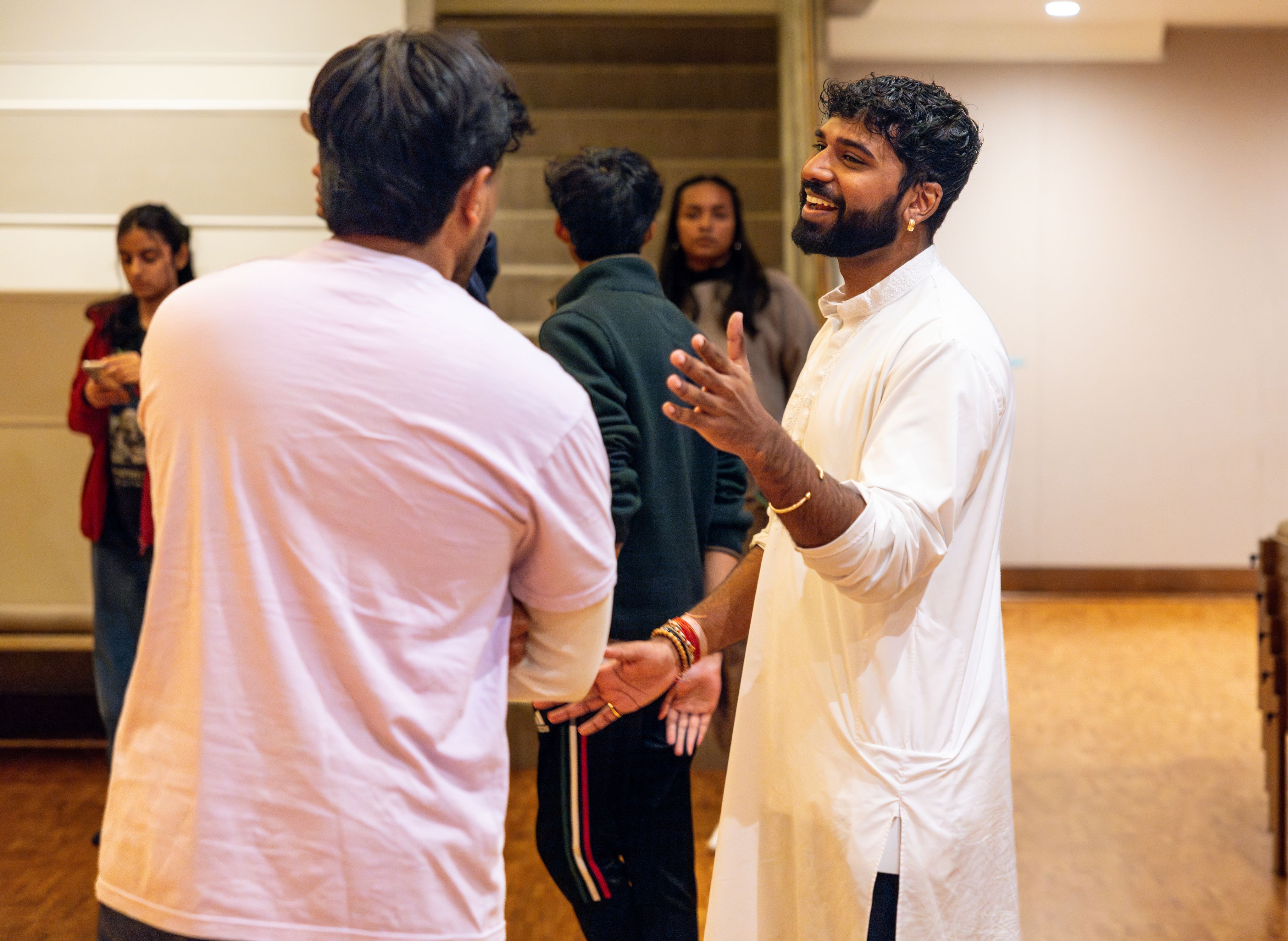 Hindu Chaplain Rajeev Persaud talking with a student