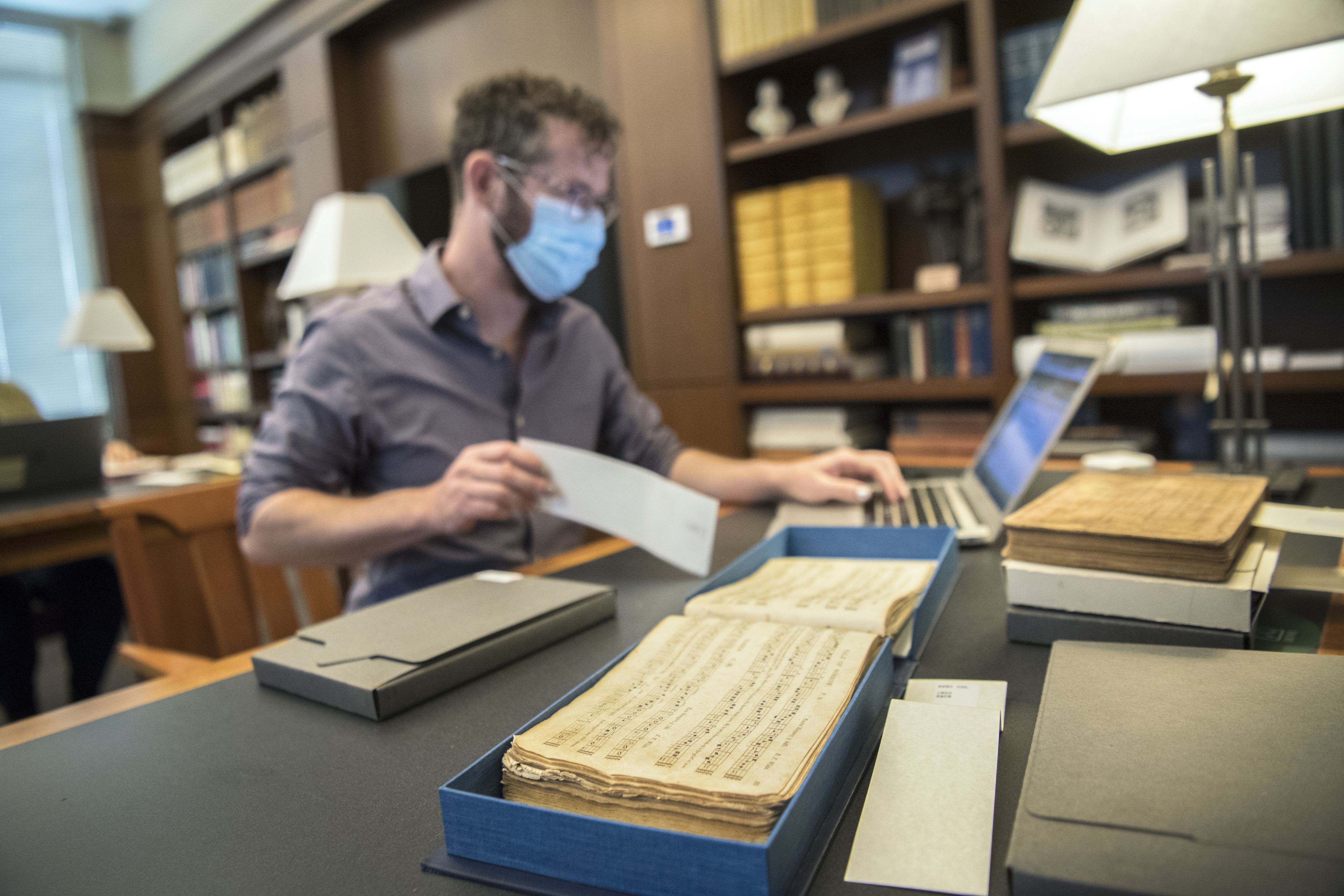 Jesse Karlsberg inputs data into the Sounding Spirit digital archive.