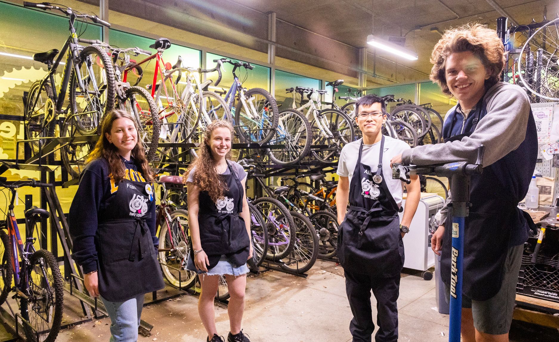 Photo of student members of Emory Bike Social at the Fixie bike repair shop on Emory's main campus.