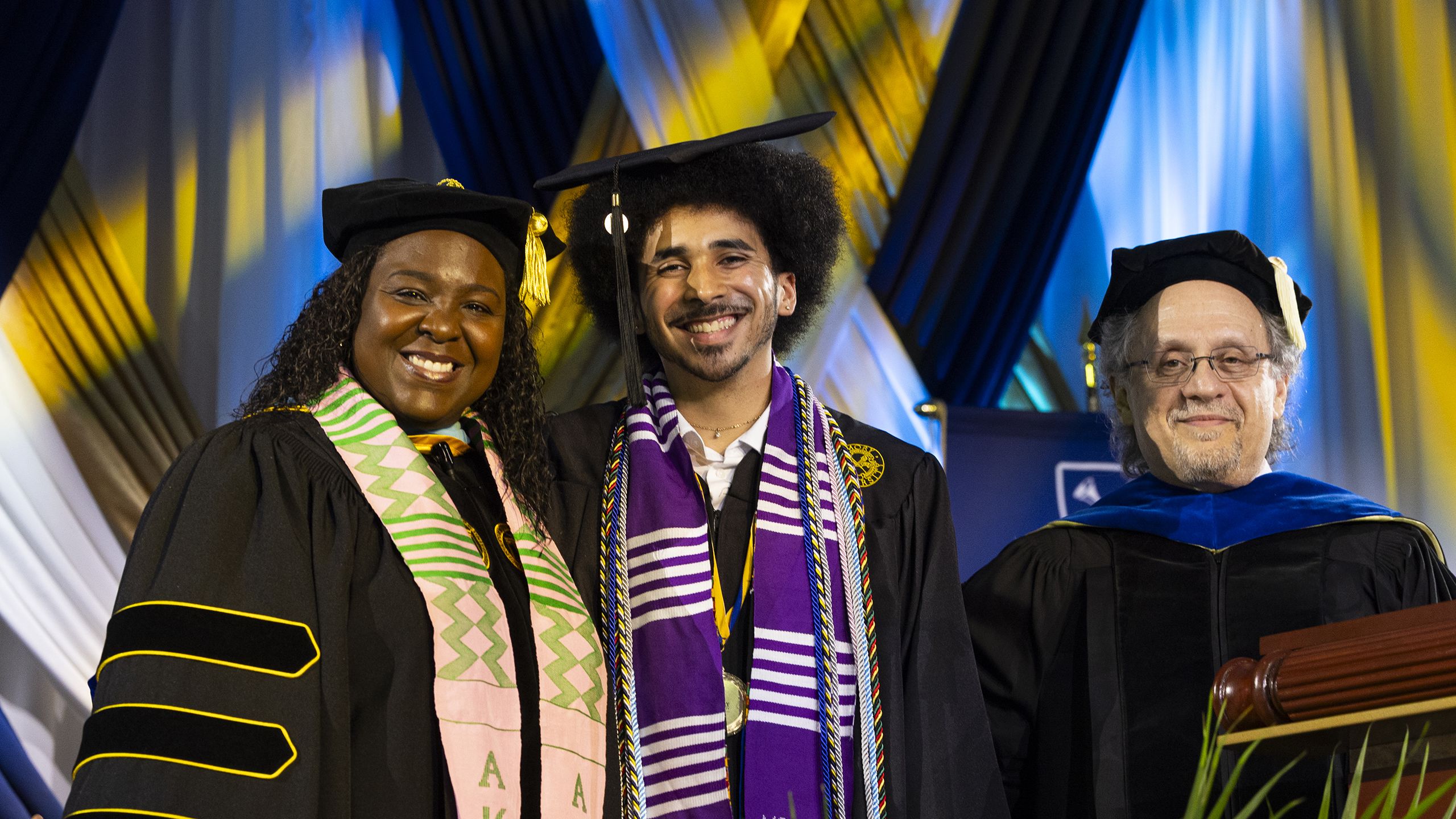 Terrence Lurry poses for a photo on stage