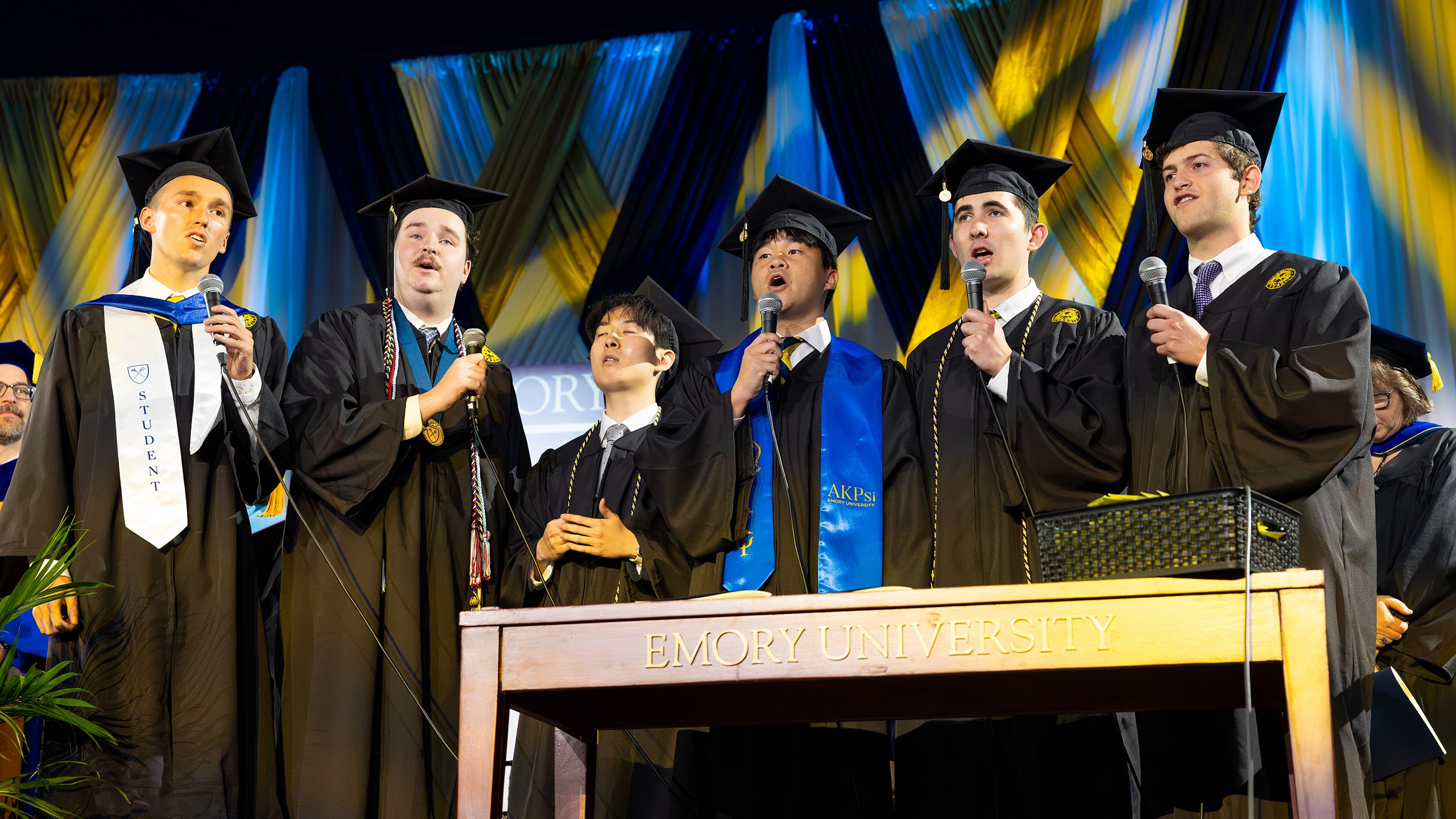 Students sing the alma mater