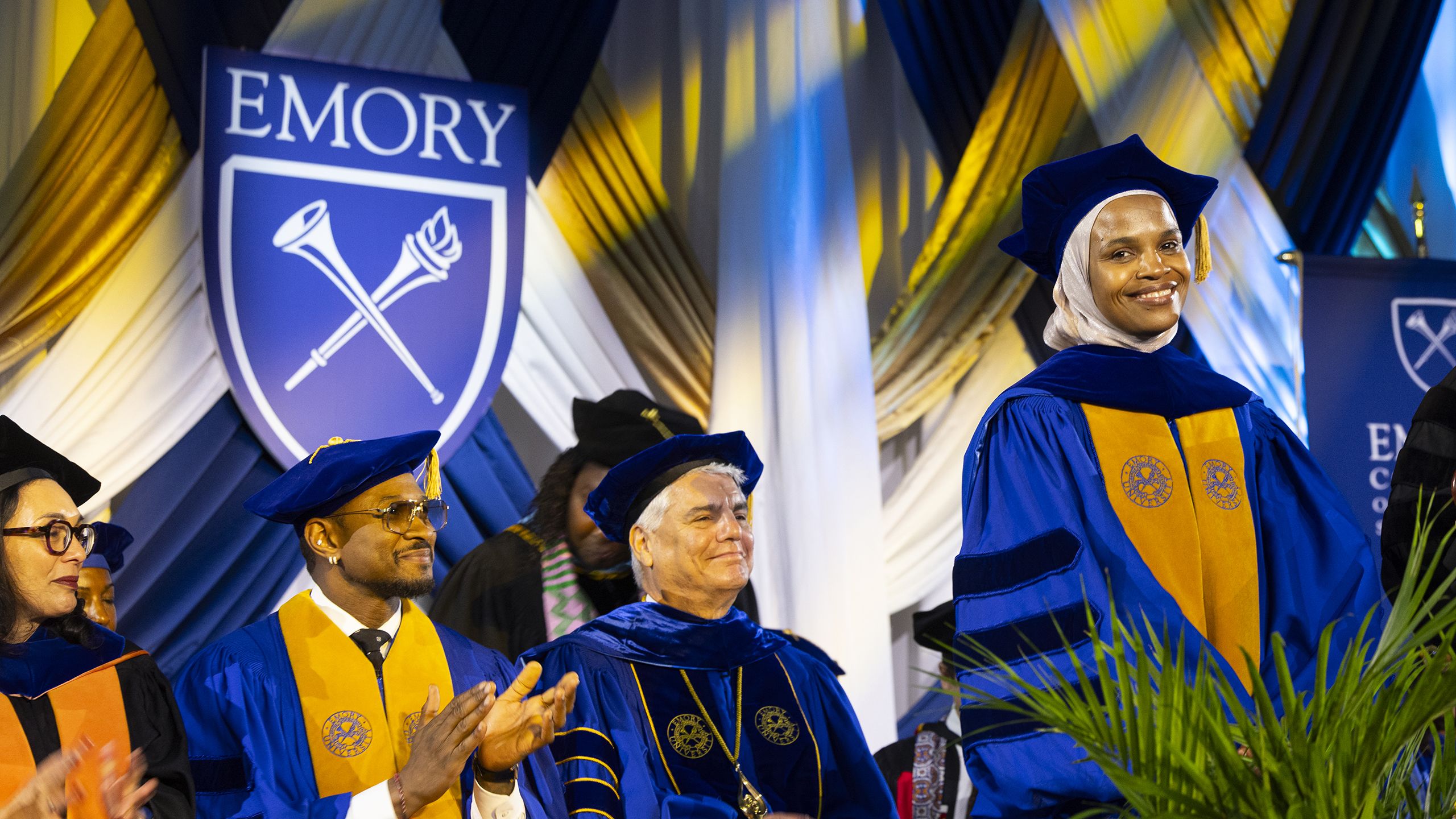 Roseline Jean Louis smiles on the Commencement stage