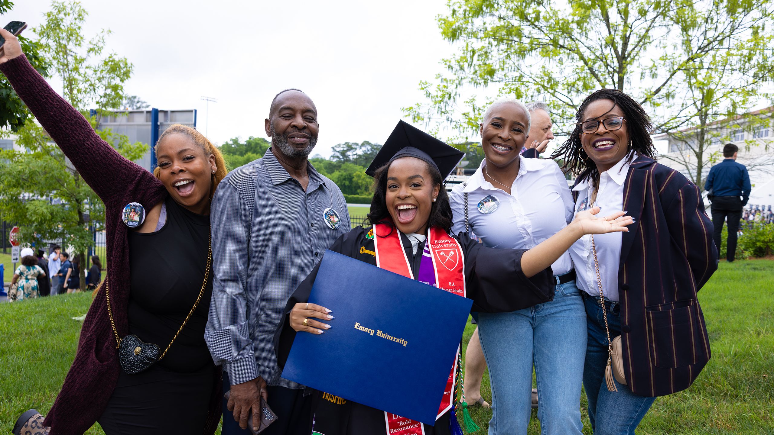 A family poses with their graduate