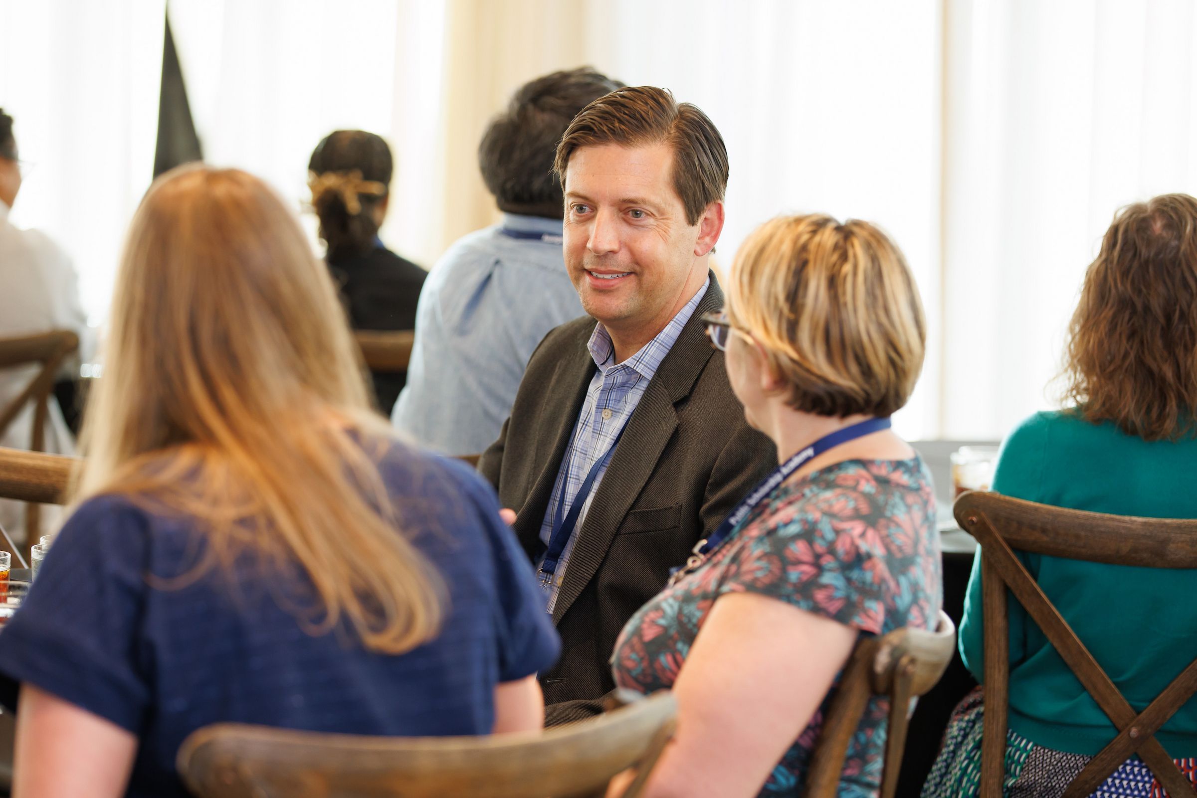 Aaron Levine at table with academy particpants