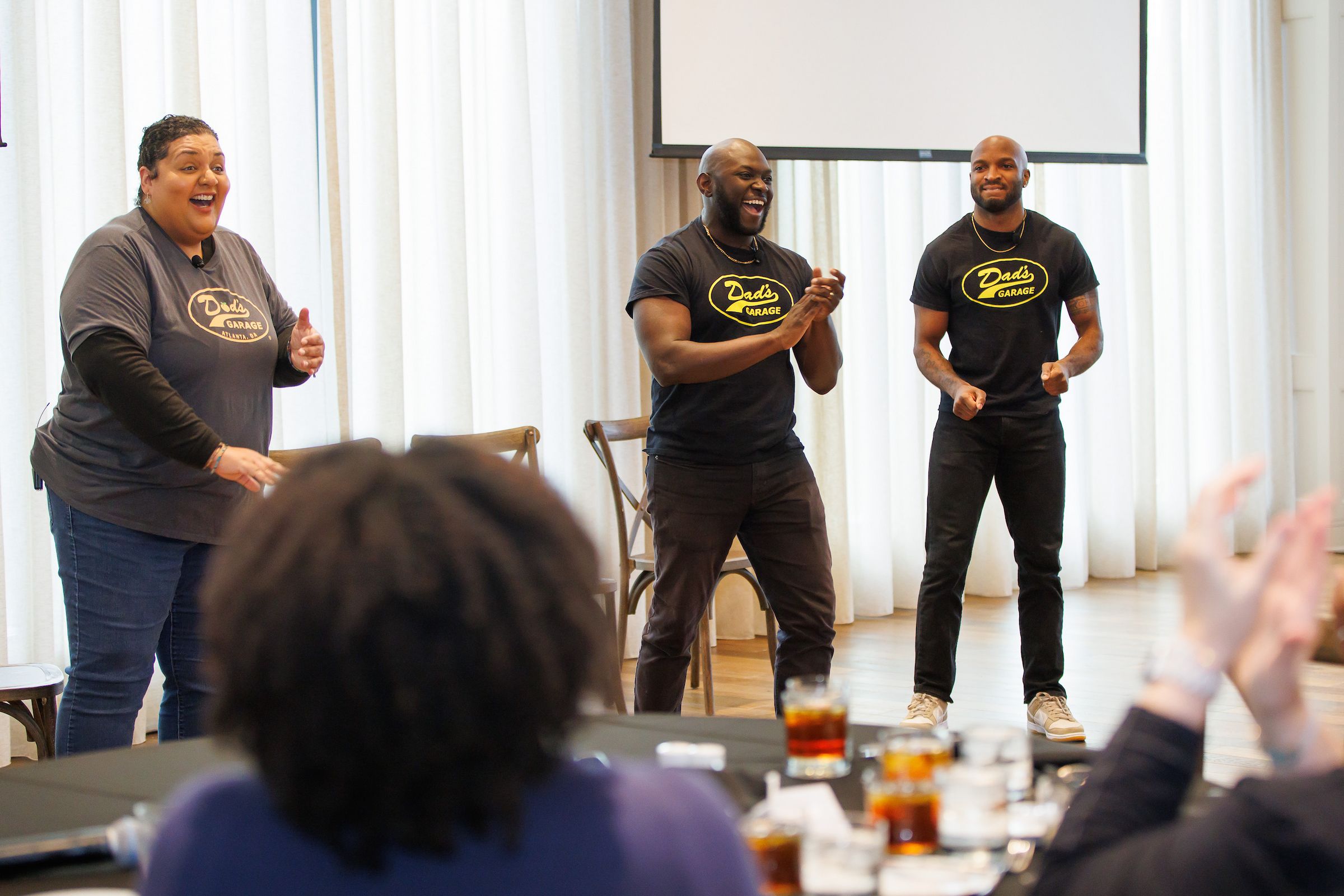 Three members from Dad's Garage improv group performing