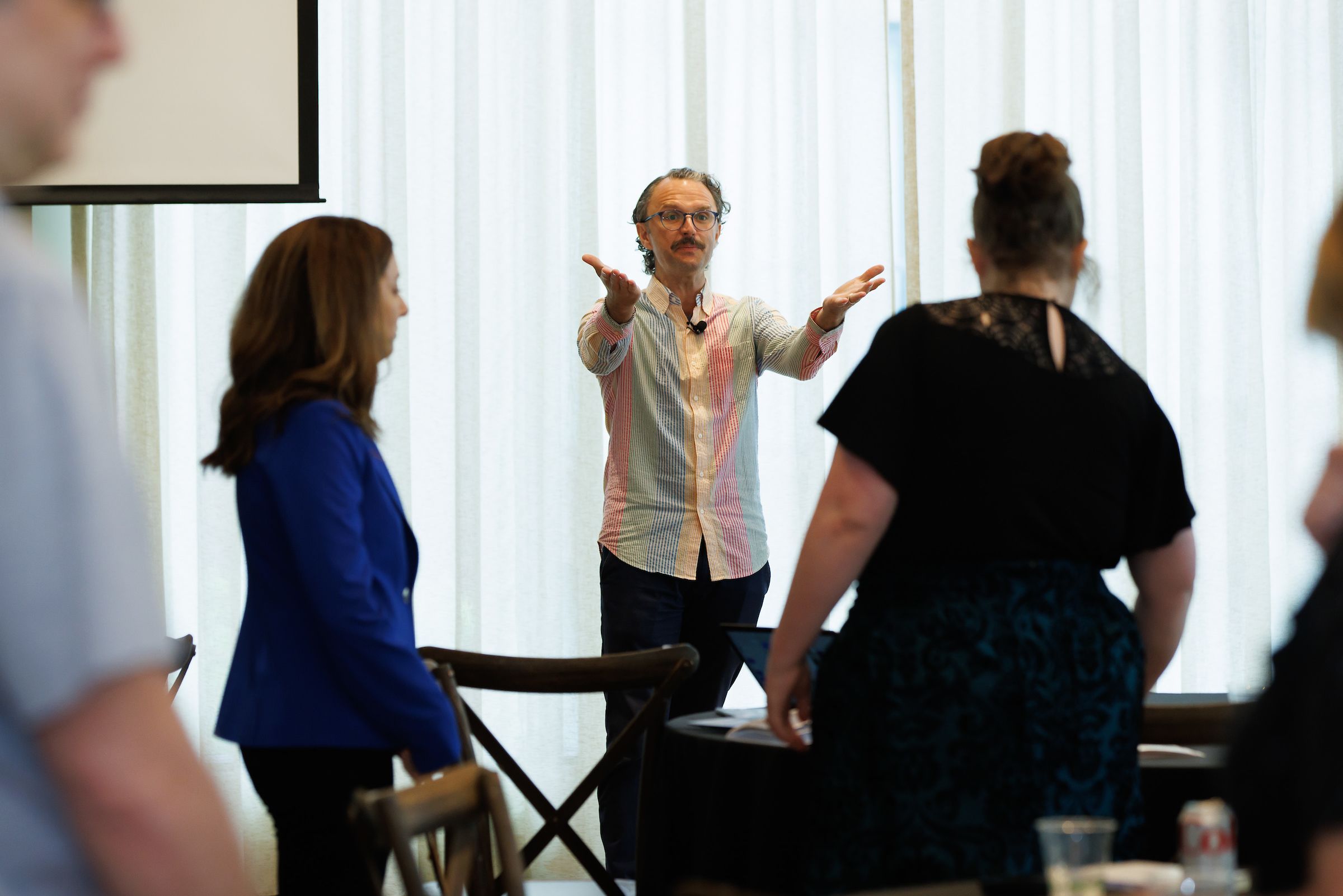 Alda Center instructor encouraging participants to stand