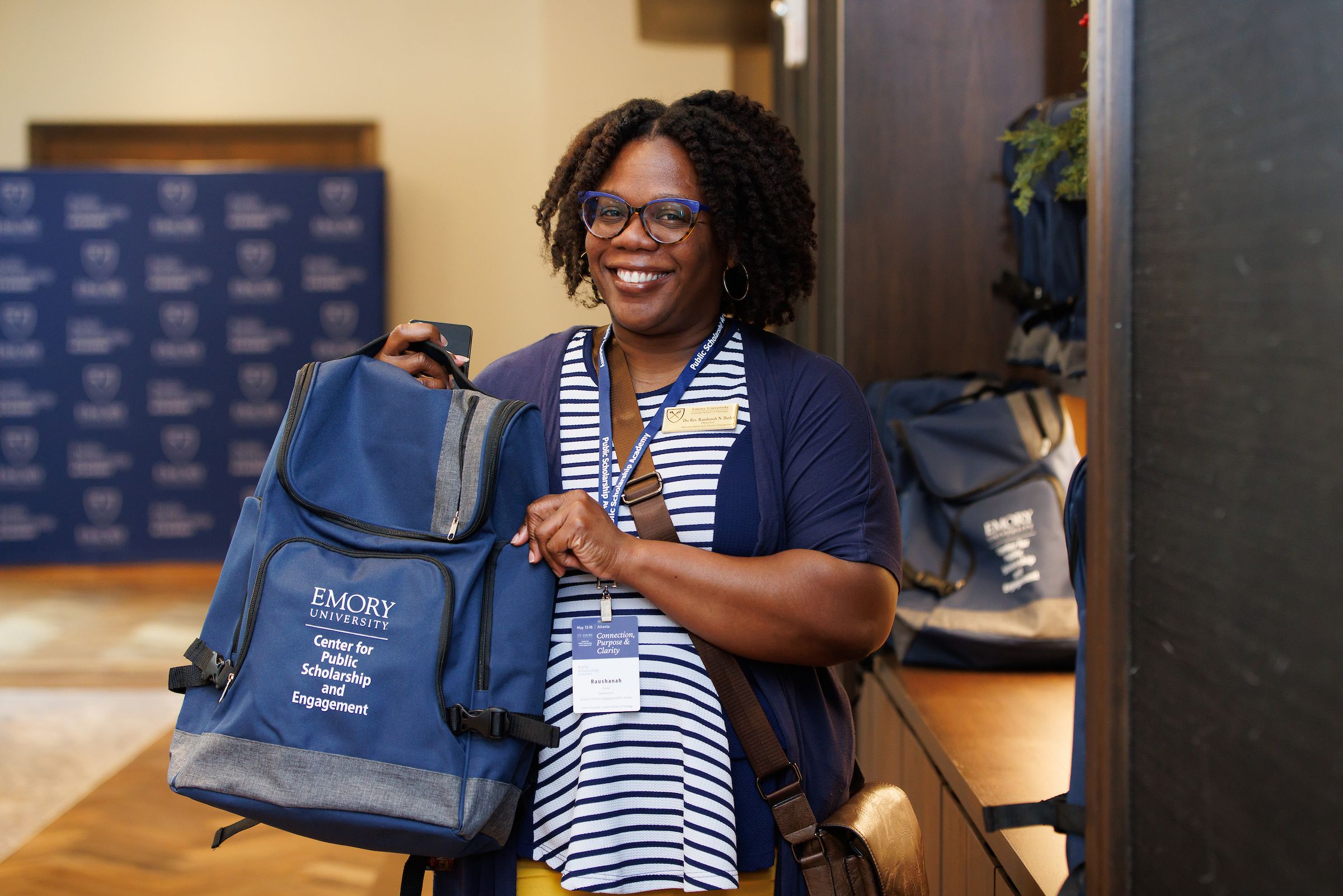woman with Center for Public Scholarship and Engagement bag