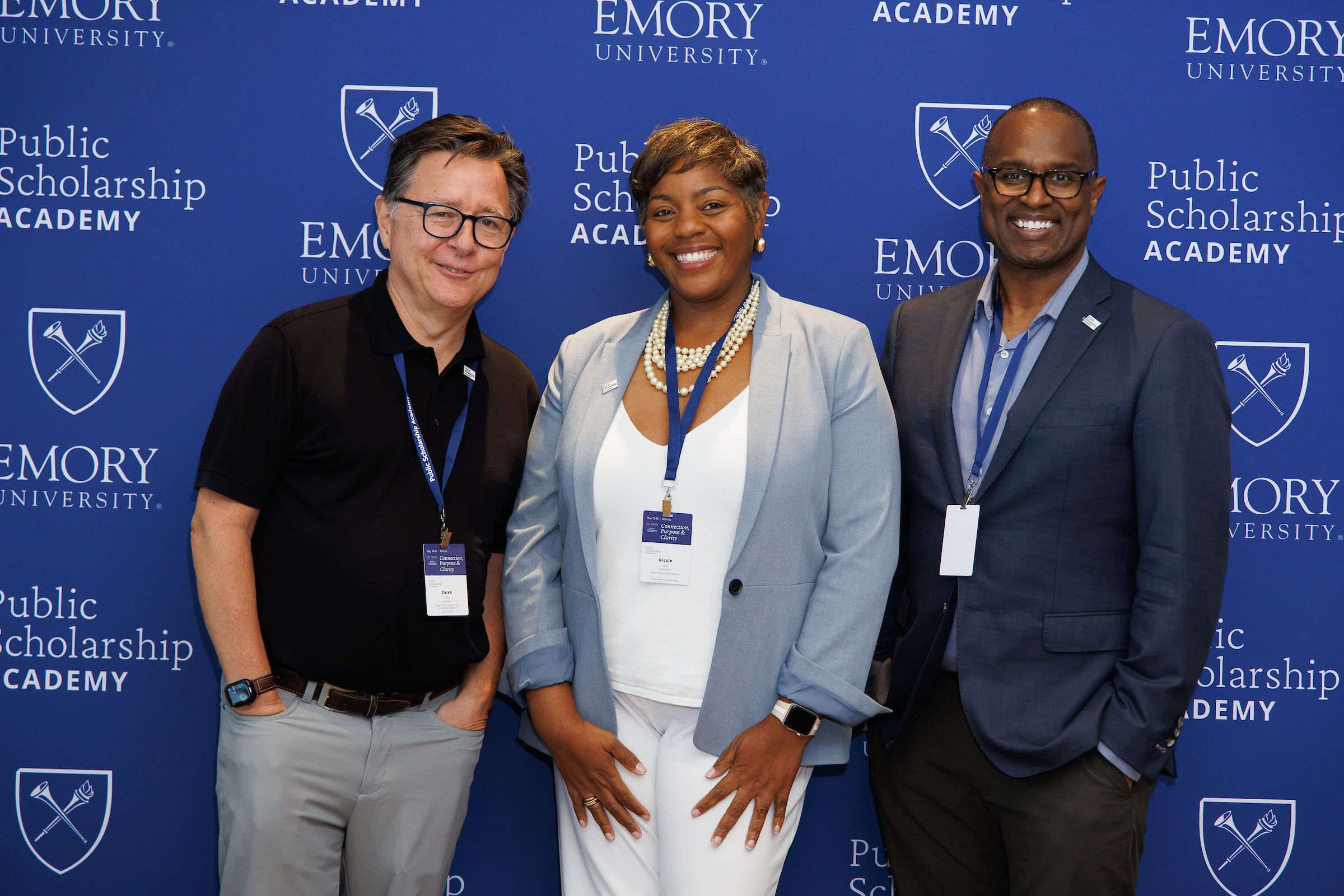 Center for Public Scholarship and Engagement leadership posing in front of academy backdrop