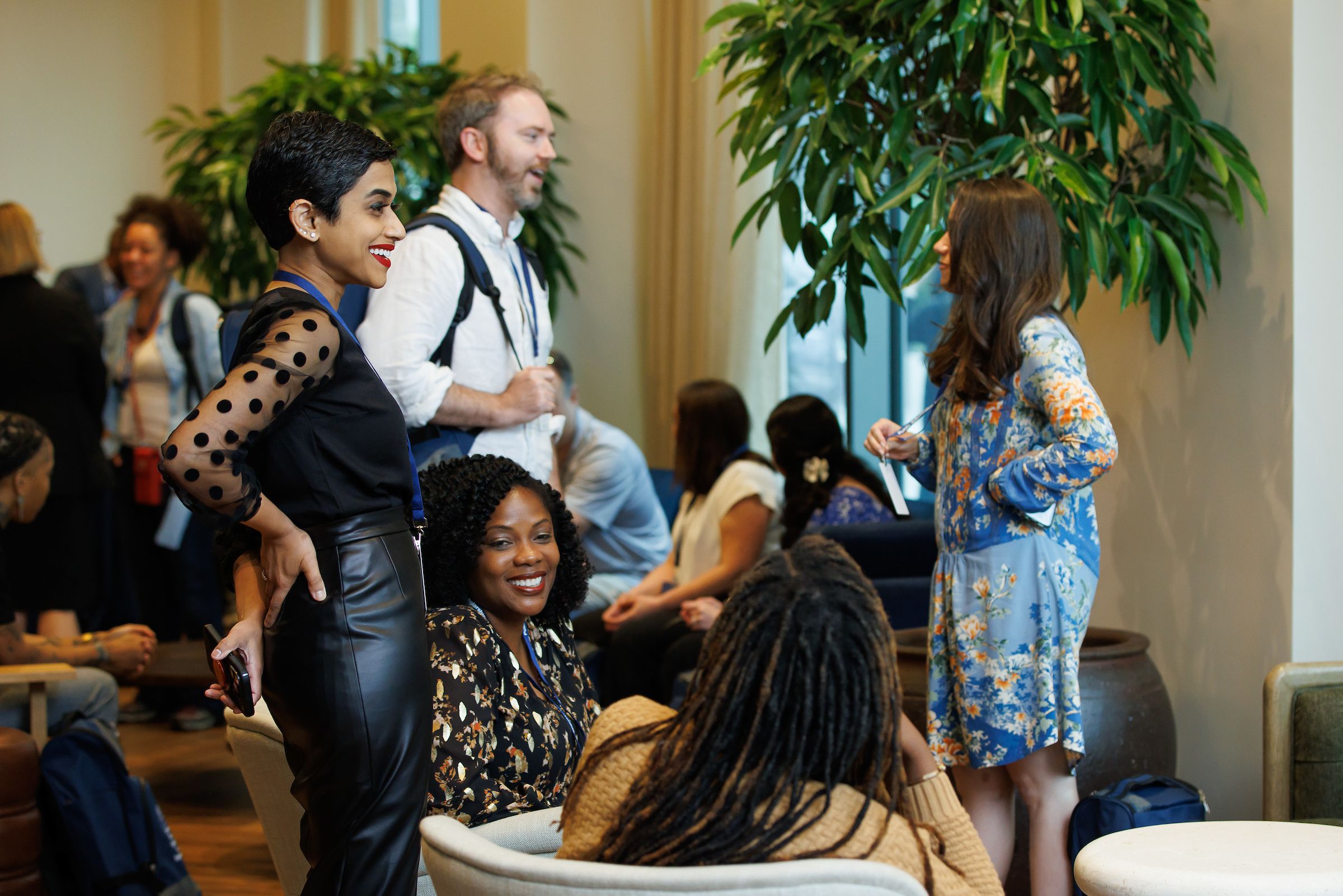Deepa Das Acevedo standing with crowd of academy participants