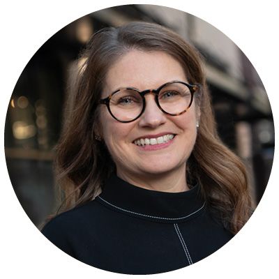Photo of smiling woman with spectacles