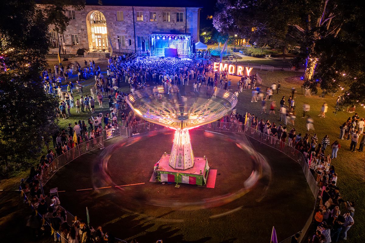 image of spinning swings at nighttime on Emory's quad