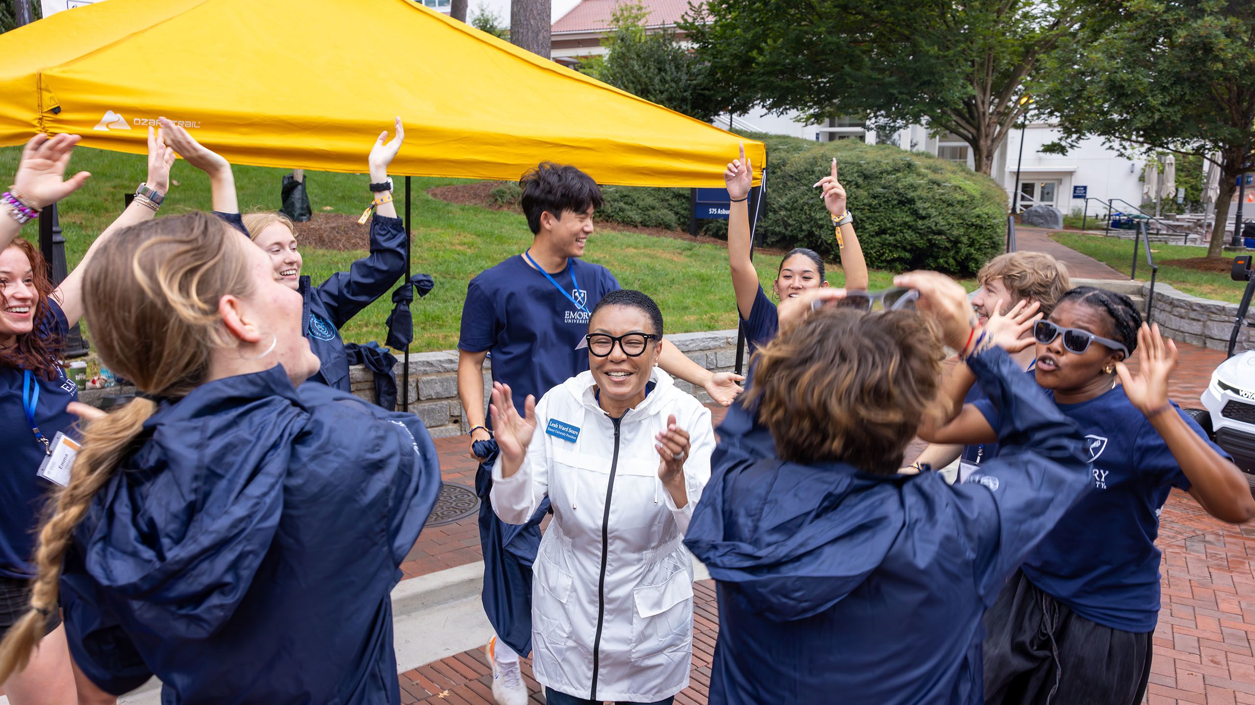 Group of student leaders clap with Interim President-elect Leah Ward Sears