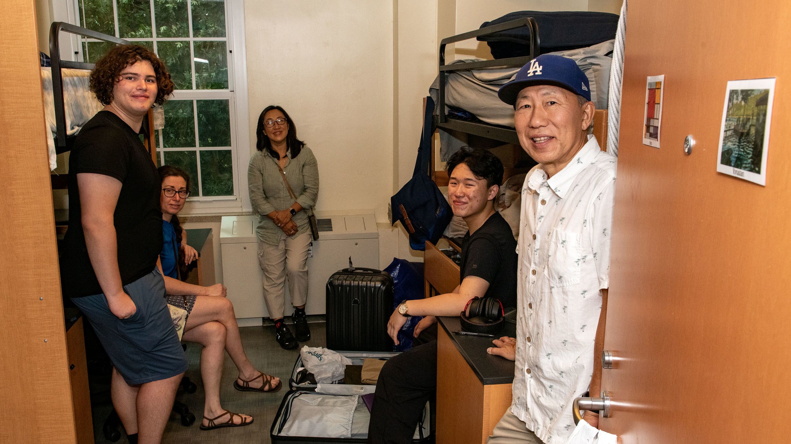 two families smiling in their sons' new room