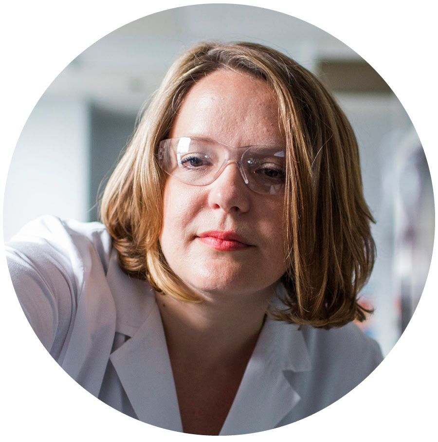 Photo of woman researcher in lab coat