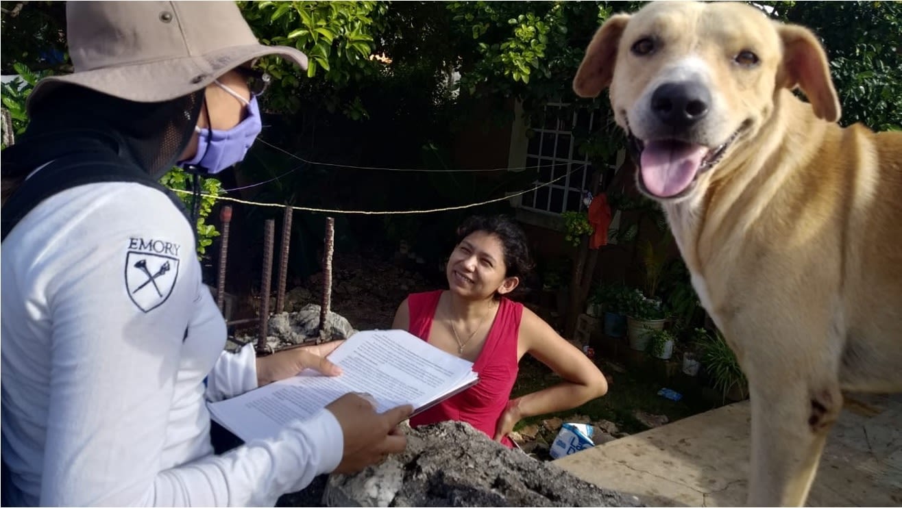 A member of the project's field team explains the study to a Merida resident.