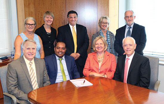 Group photo in a conference room.