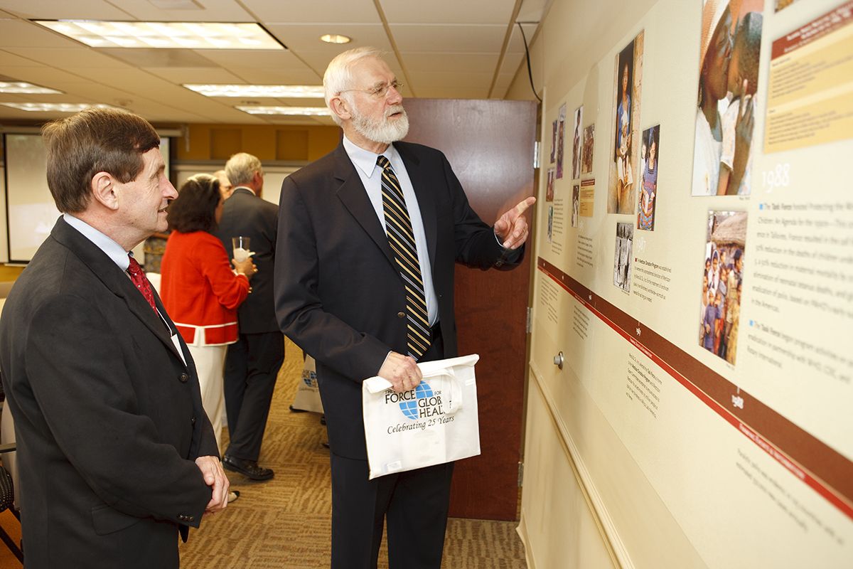 James Curran and William Forge look at a wall display