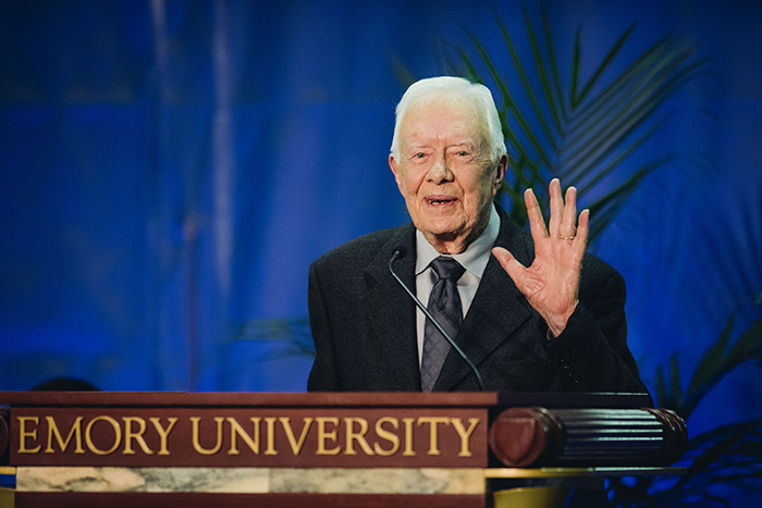 President Jimmy Carter waves at the audience.