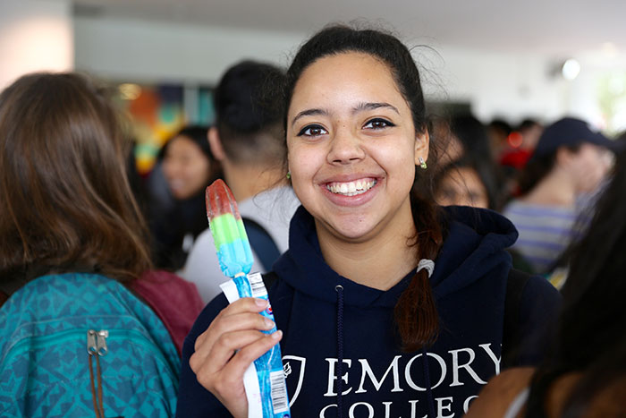 Students eat popsicles at Dooley's Week events.