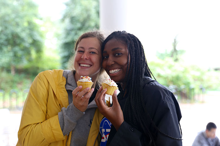 Students eat cupcakes at Dooley's Week events.