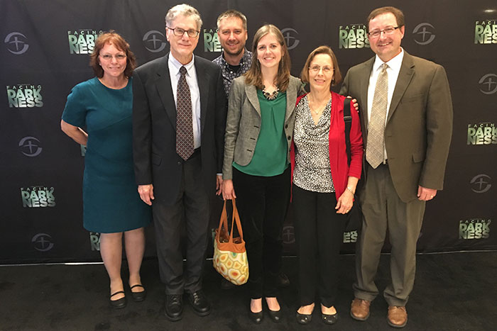 Kate Boulter, a nurse from the Nebraska Biocontainment Unit; Bruce Ribner; Andrew Kraft; Colleen Kraft; Barbara Ribner; and Christopher Kratochvil, research dean at Nebraska Medicine, pose for a photo at the Ebola documentary in screening.