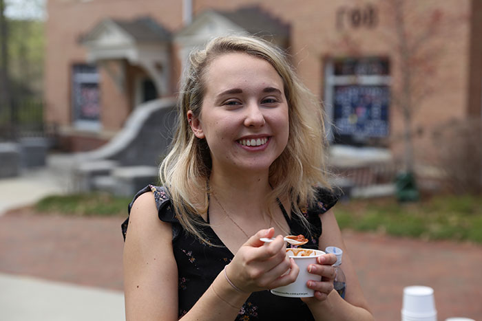 A student participates in the first annual Greeks Go Green vegetarian chili cook-off.