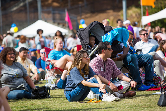 Several members of the Emory community sit on the lawn at the 2017 homecoming concert.