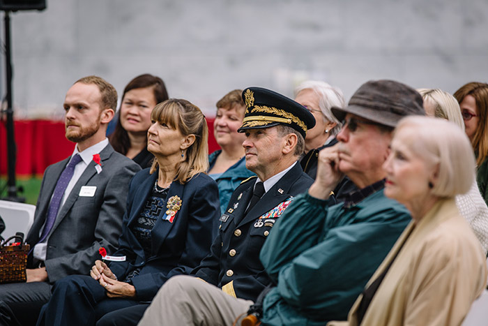 The crowd composed of many in the Emory community listens to President Claire E. Sterk at the 2017 Veterans Day Ceremony.