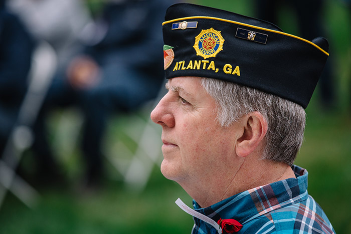 A veteran listens to a speaker at the 2017 Veterans Day Ceremony.