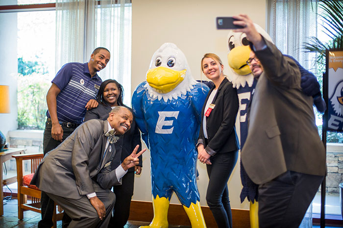 Students, faculty and staff pose with Swoop at the unveiling of the new Swoop statue at the Emory Conference Center Hotel.