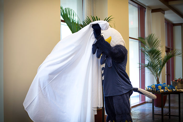 Swoop himself unveils the new Swoop statue at the Emory Conference Center Hotel.