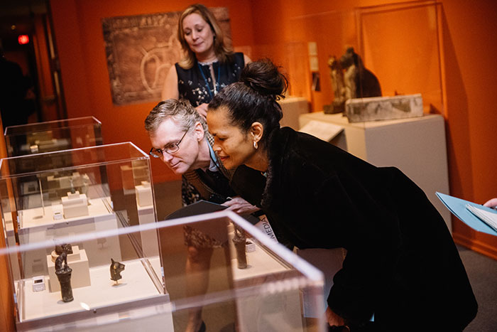 Members of the Emory community look at items in the gallery