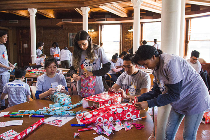 Students help wrap gifts