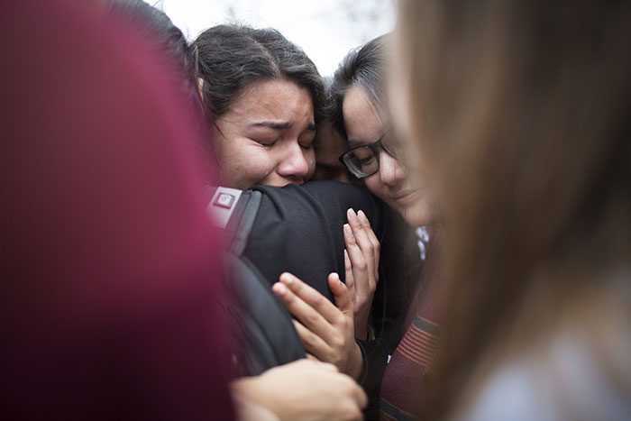 Students embrace at the student vigil for victims of the shooting in Parkland, Florida