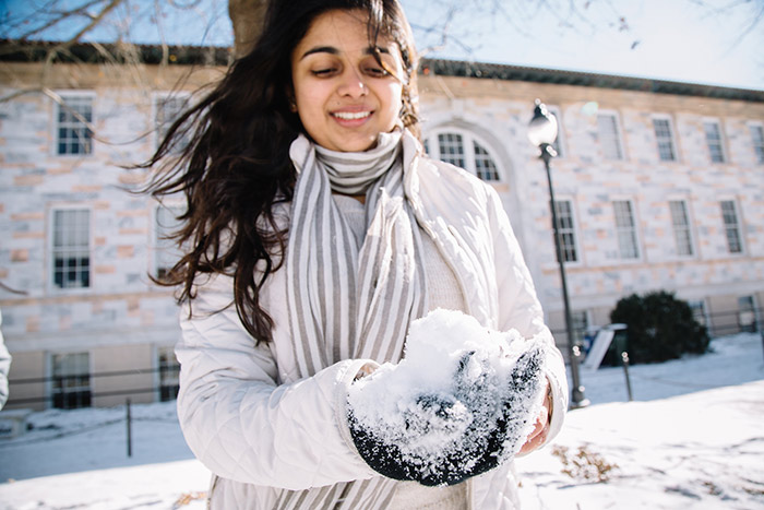A student makes a snowball