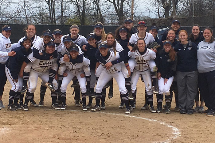The Emory softball team poses for their UAA title