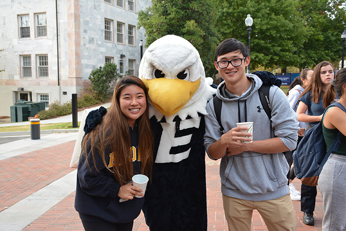 Swoop poses with students