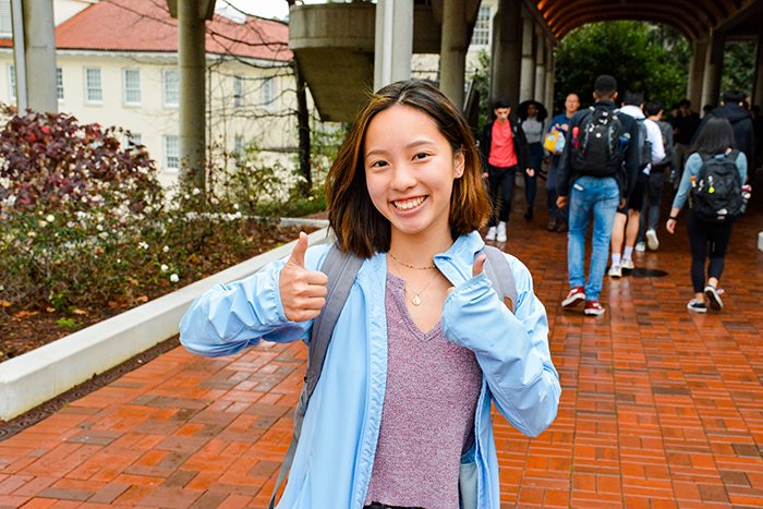 A student gives a thumbs up