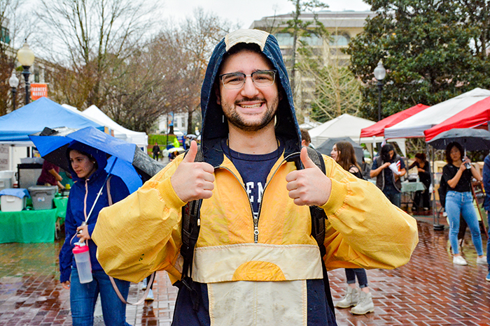 A student gives two thumbs up for the first day of classes