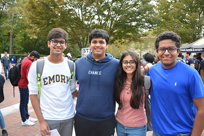 Four students pose for a photo