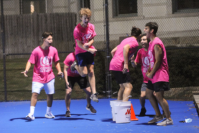Students in pink t-shirts compete in the Oxford Olympics