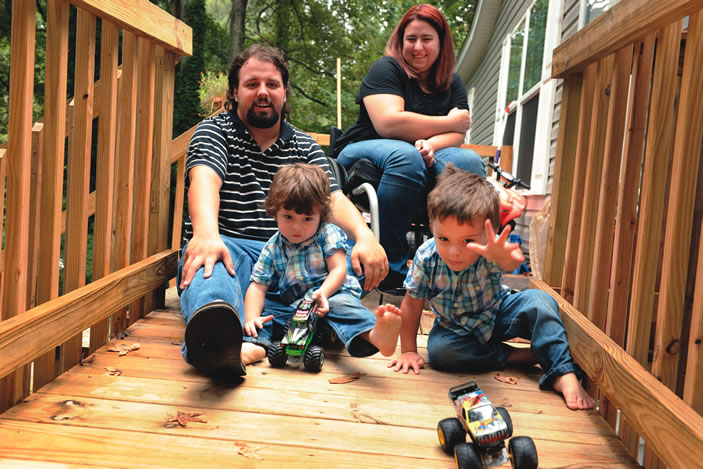 Alex and Ashley Patton play with twins Avery and Brantley at their home near Lake Lucerne. Ashley, a paraplegic, was faced with a large blood clot in her heart when six months month pregnant with the twins. 