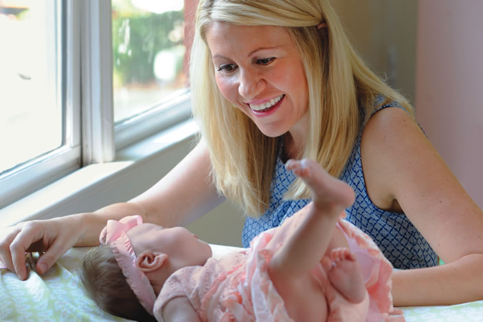 Edita Tracey plays with her daughter Arabella. 8-months pregnant, Edita suffered a massive tear in her aorta. 