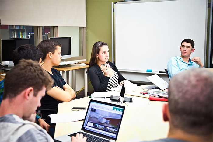 Students in the fall 2014 course on the Georgia Civil Rights Cold Cases Project discuss the case of the Rev. Clarence H. Pickett, who was killed in 1957.