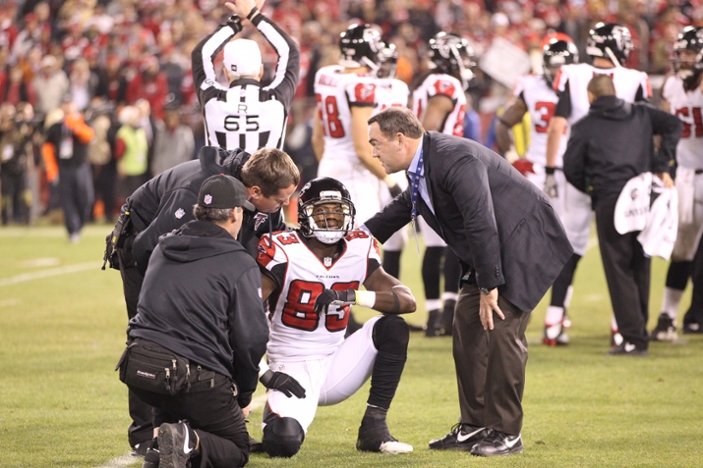 Emory physicians on the field with Atlanta Falcons players