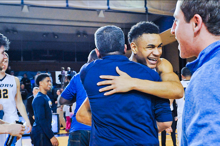 emory player hugging person in celebration