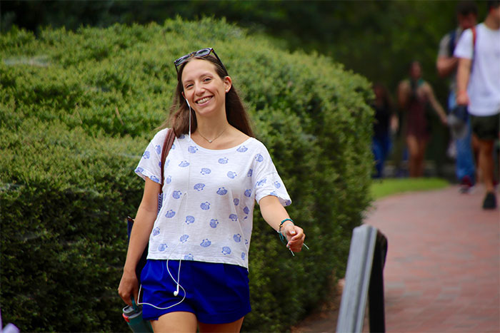 woman walking on campus